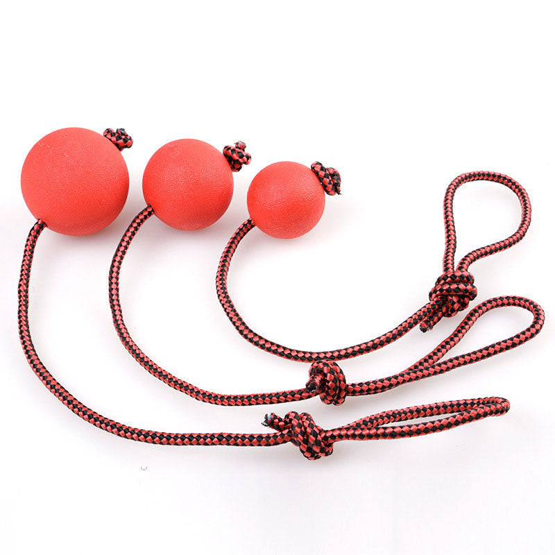 Bite resistant rubber ball with rope solid elastic